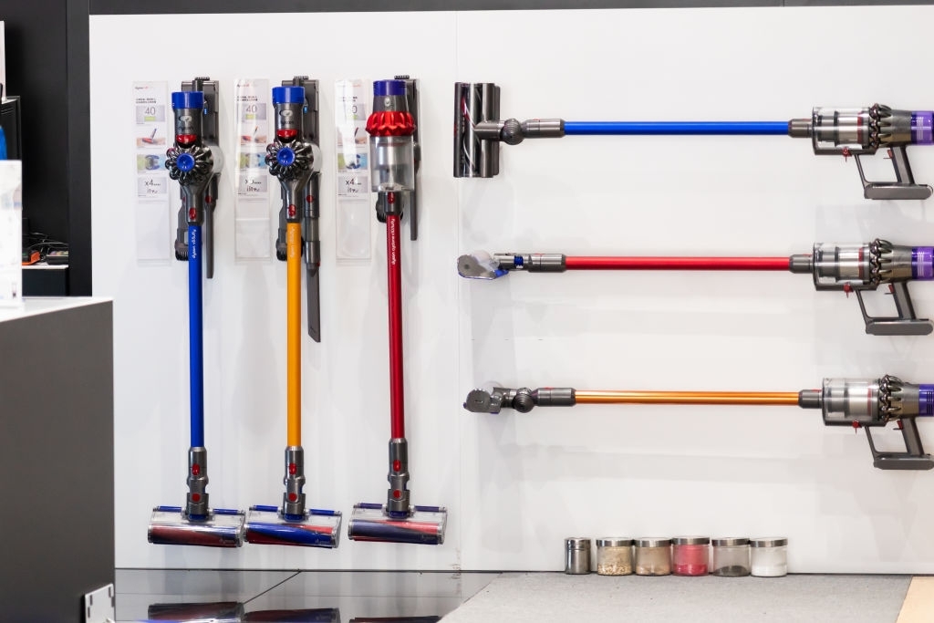 dyson V11 series vacuum cleaners in three different colors