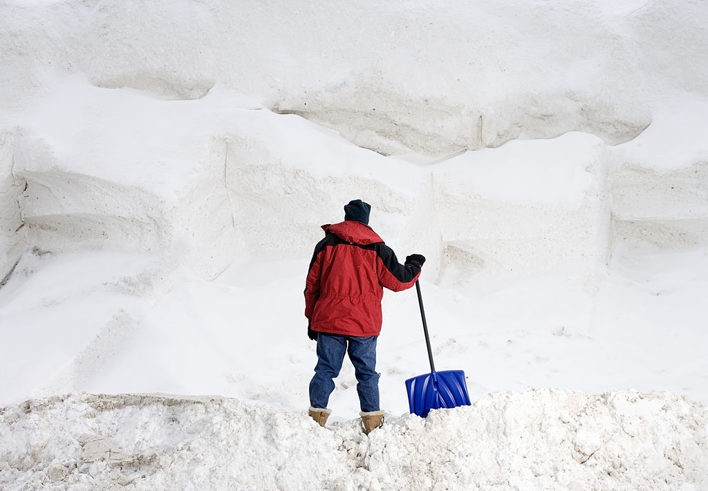 man-having-a-hard-time-shoveling-snow